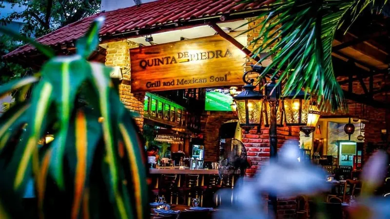 Restaurant district on 5th Avenue Playa del Carmen showing open-air dining with Mexican and international cuisine options