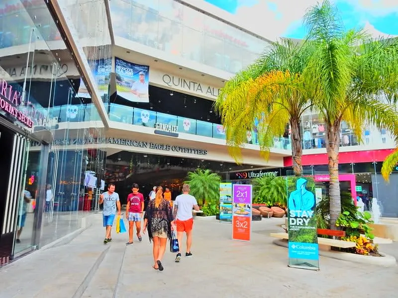 Quinta Alegria mall on 5th Avenue Playa del Carmen — open-air shopping center with jungle-themed interior and international retail stores