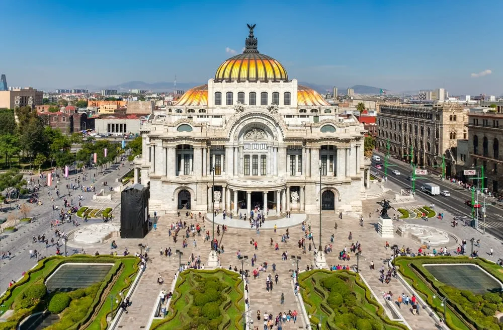 Palace of Fine Arts marble facade and orange dome in Mexico City