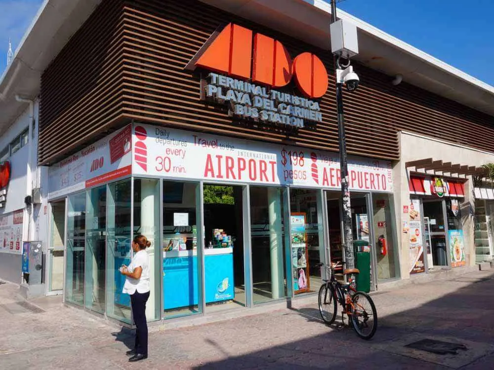 ADO bus at Cancun airport — the bus connects Hotel Zone to the airport, but there's no direct bus service all the way to Monterrey