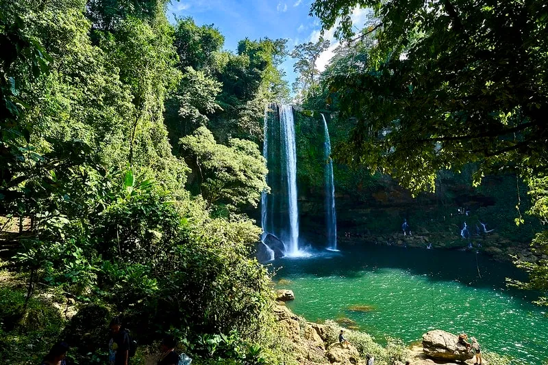 Waterfall near Palenque in August with stronger rainy-season flow and slippery paths
