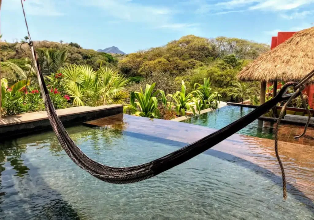 Sayulita hillside bungalow surrounded by jungle greenery