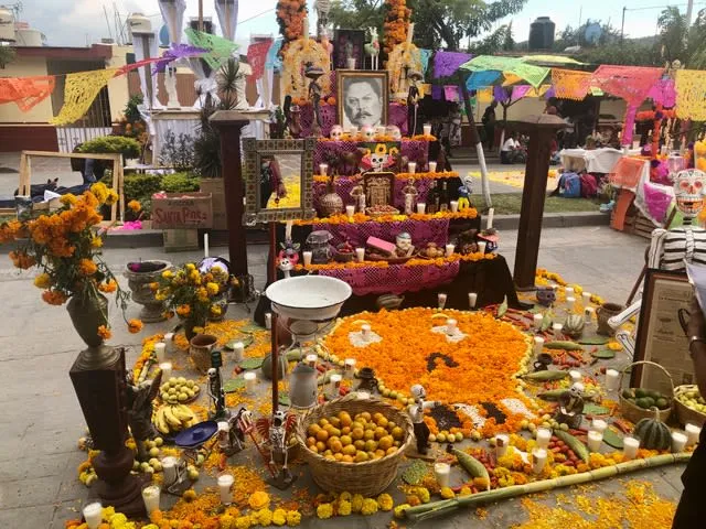Ajijic Mexico cemetery decorated with marigolds and candles during Día de Muertos celebration