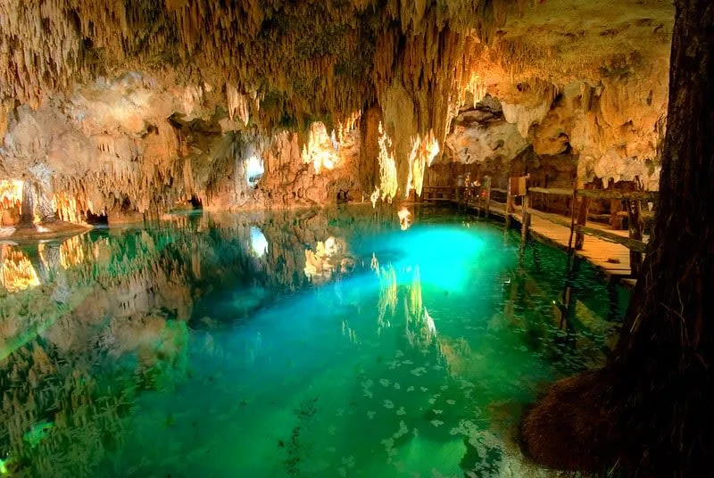 Cenote in Mexico's Yucatan Peninsula — cenotes remain crystal clear in June, offering relief from Caribbean coast heat