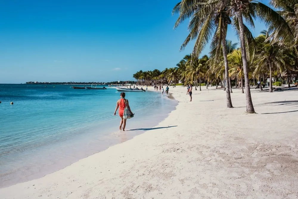 Akumal Bay beach aerial view showing turquoise Caribbean water and white sand Riviera Maya Mexico
