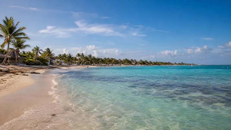 Akumal Bay in March with turquoise water and pale sand on the Riviera Maya
