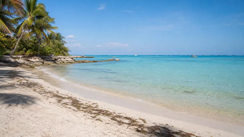 Akumal Bay in May with turquoise Caribbean water and pale sand on the Riviera Maya