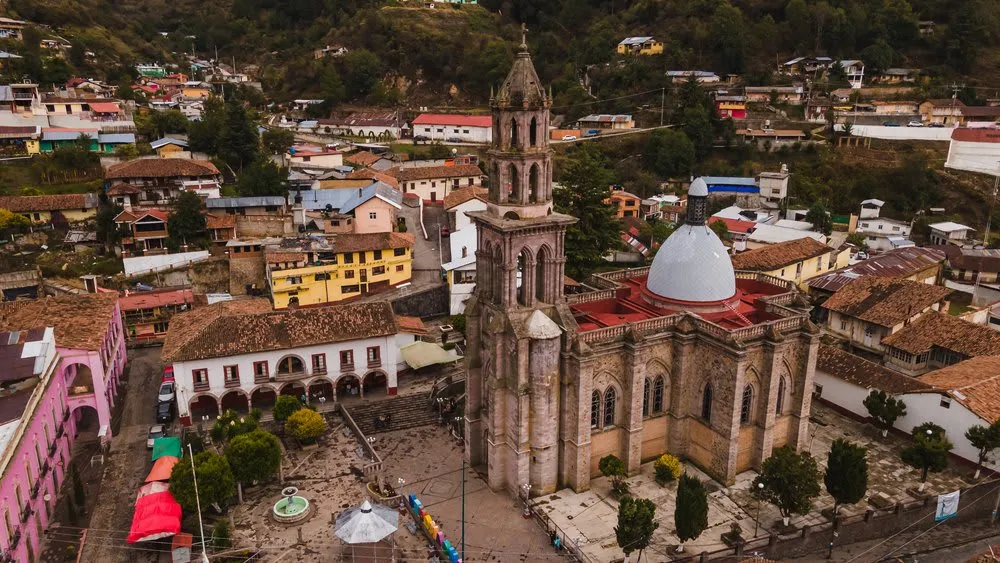 Temple of the Immaculate Conception above Angangueo rooftops