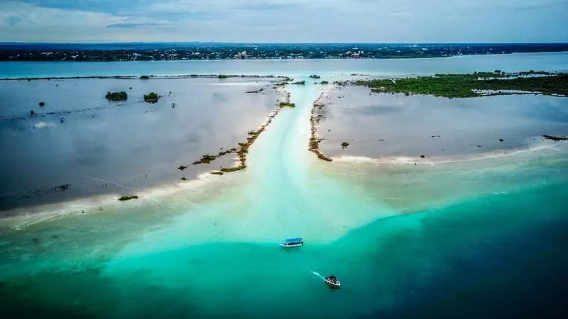 Clear turquoise water along the Bacalar lagoon shore on a sunny dry-season day