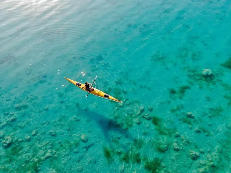 Aerial view of Bacalar Lagoon in November with turquoise and deep-blue water