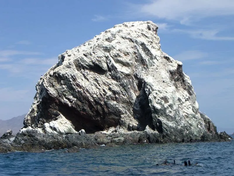 Rocky La Calavera Island rising from blue water near Bahia de Los Angeles