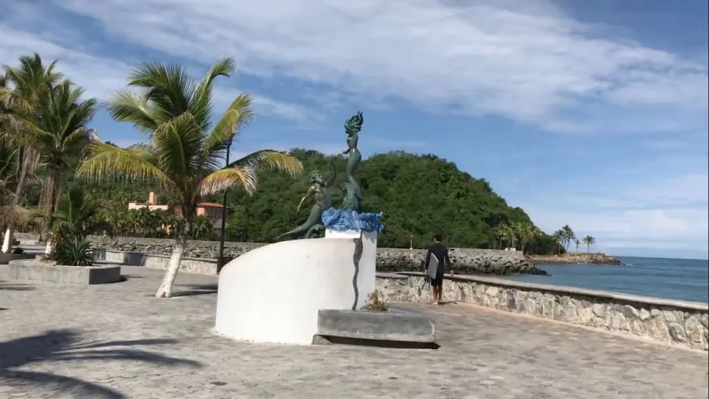 Barra de Navidad malecon boardwalk — the seafront promenade lined with restaurants and bars overlooking fishing boats