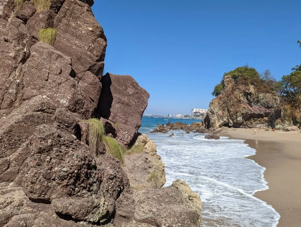 Amapas Beach with yellow sand and trees south of Old Vallarta