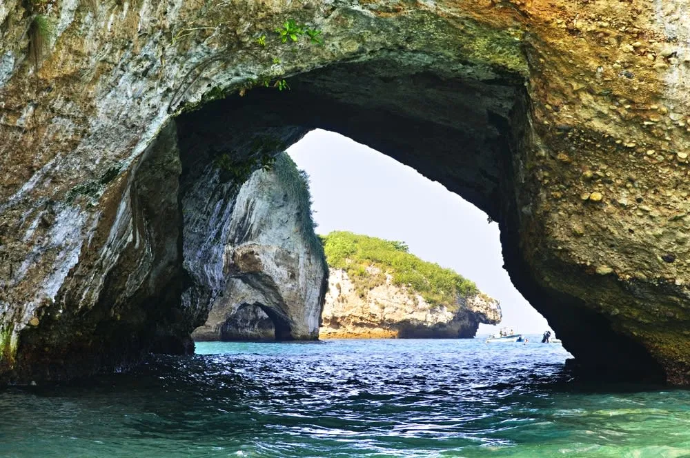Los Arcos marine rocks rising from deep blue water near Mismaloya