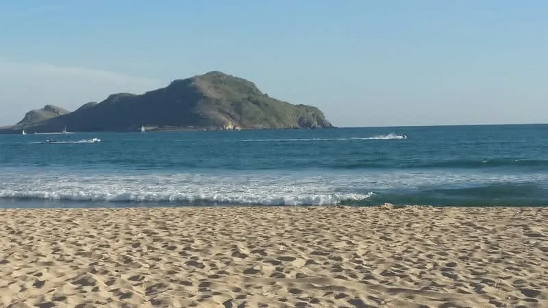 Playa Gaviotas shoreline in Mazatlan with golden sand and blue Pacific water