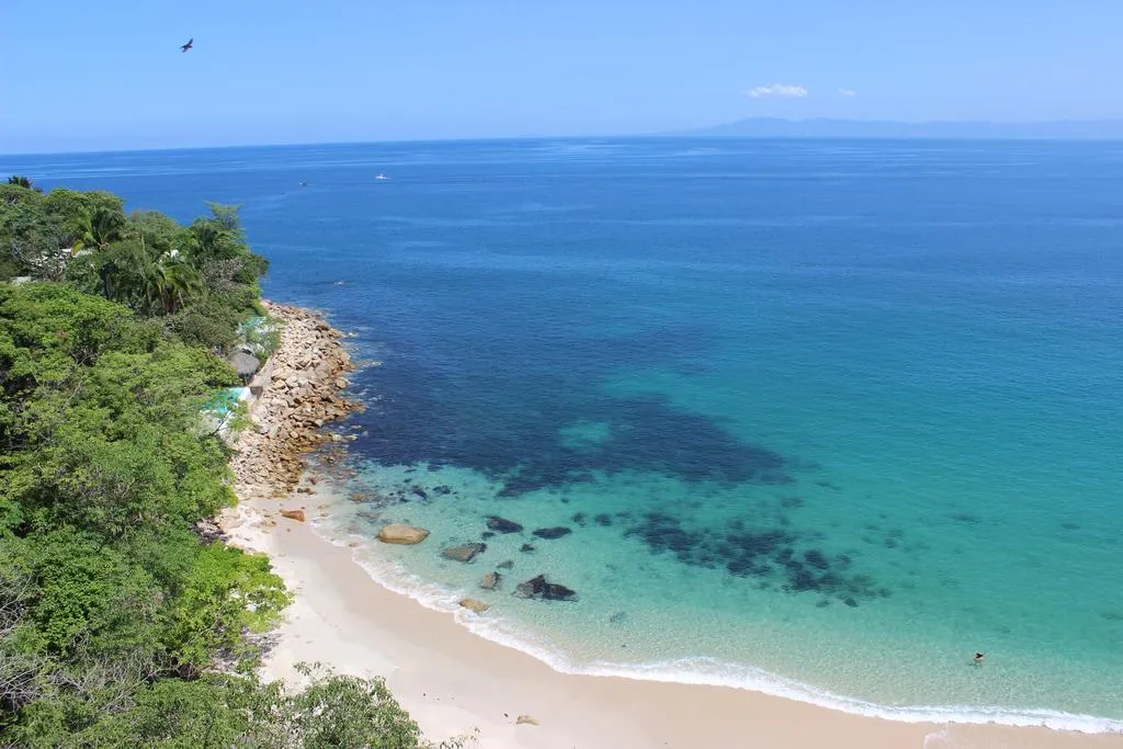 Turquoise water and pale sand at Playa Las Gemelas near Puerto Vallarta