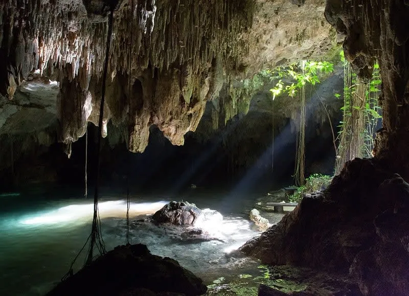 Chaak Tun cenote near Playa del Carmen — two connected caves one lit artificially one by natural skylight