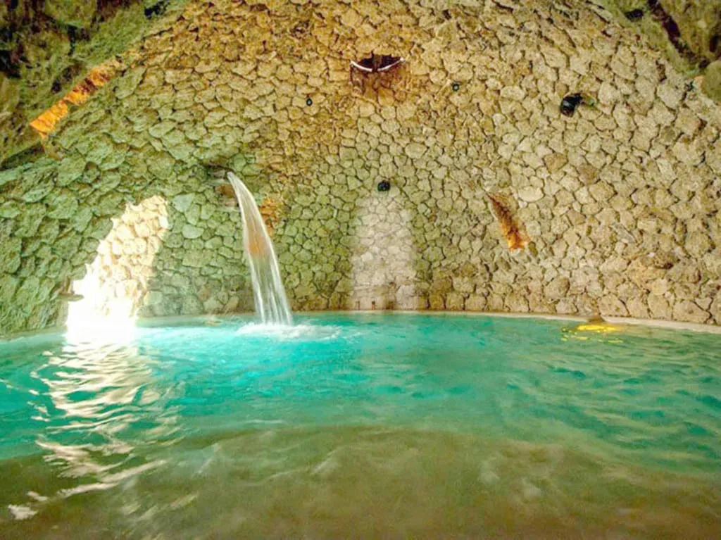 Mayan Baths underground thermal tunnels in San Miguel de Allende Guanajuato — quartz stone walls and candle-lit pools