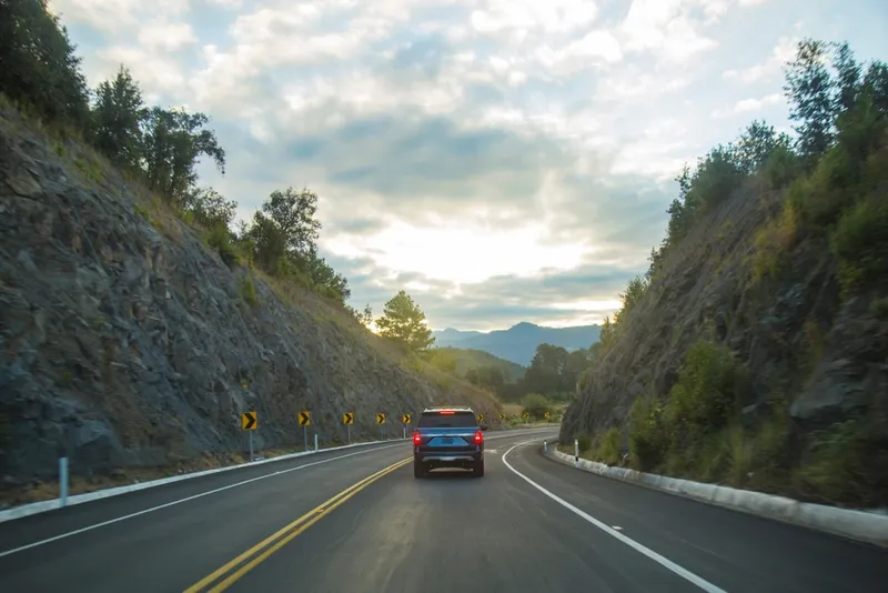 Open road through Mexico with mountains and blue sky