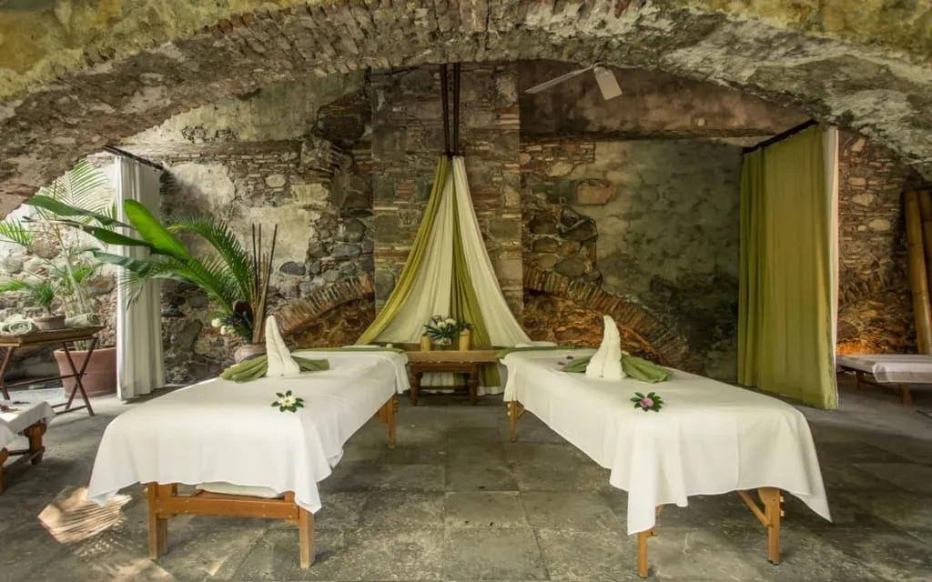 Amate Spa at Hacienda San Gabriel with rustic garden paths and colonial hacienda walls