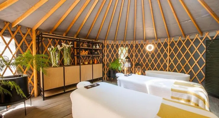 Rodavento Valle de Bravo spa pool surrounded by forest cabins and mountain greenery