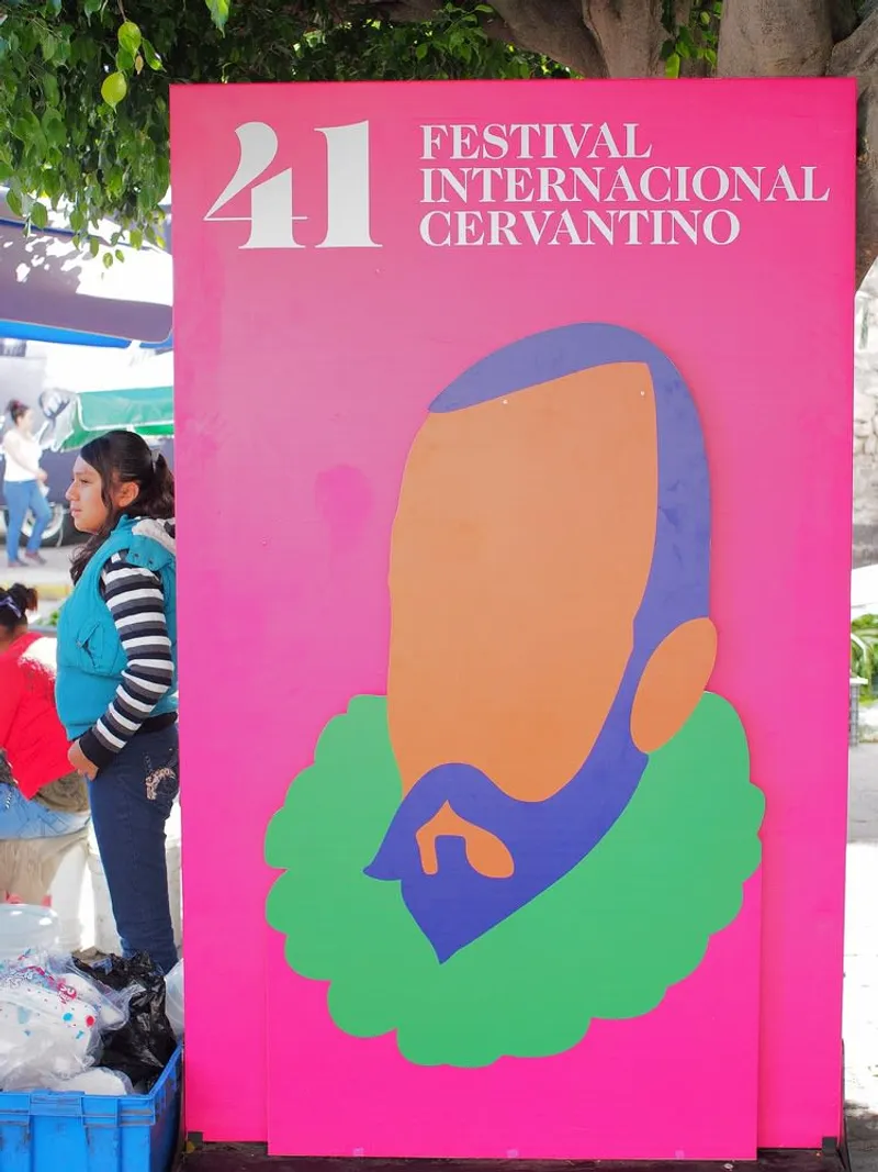 Open-air performance at the International Cervantino Festival in Guanajuato, artists performing on a plaza stage