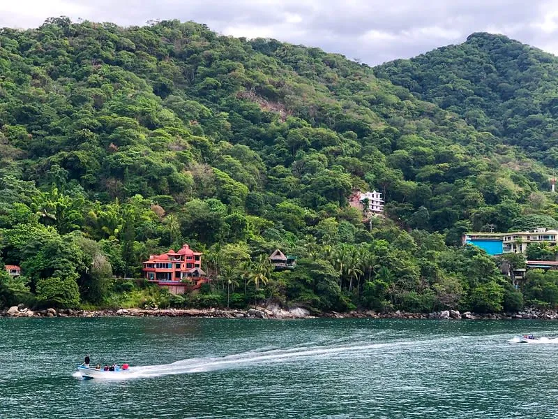 Water taxis lined up where the Horcones River meets Boca de Tomatlan beach