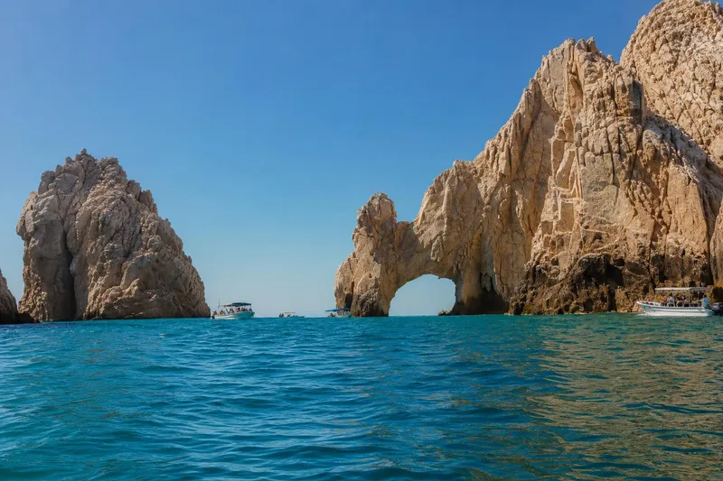 El Arco and tour boats off Cabo San Lucas during clear June weather