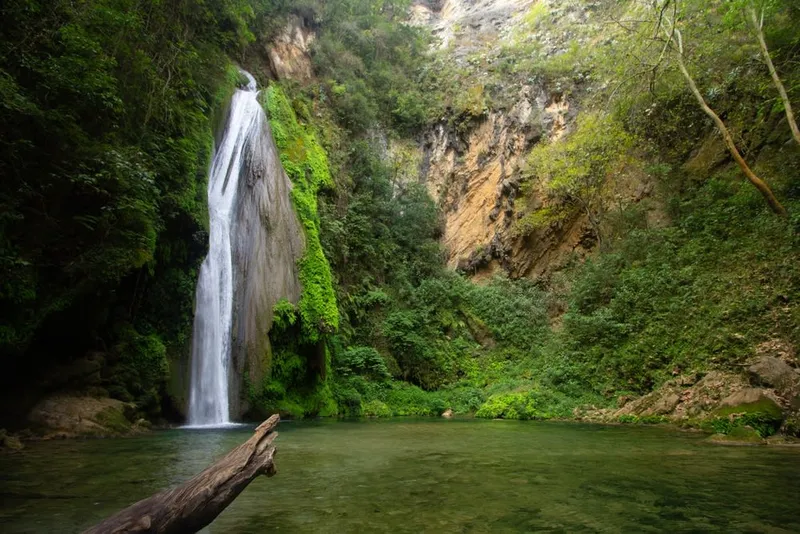 Chuveje Waterfall surrounded by lush green vegetation in Sierra Gorda, Querétaro