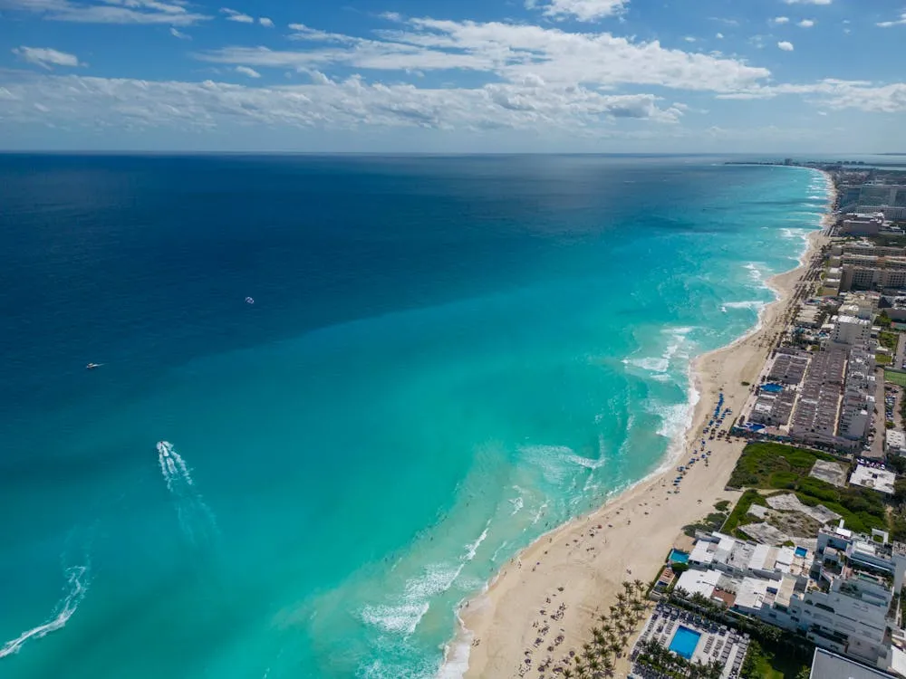 Cancun Hotel Zone strip aerial view with beach clubs and bars