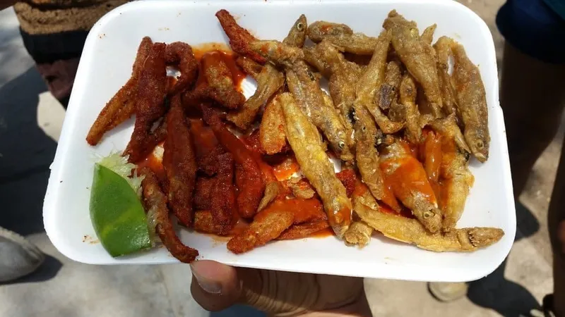 Fresh charales fish displayed at a Mexican market showing their distinctive silver coloring and small size