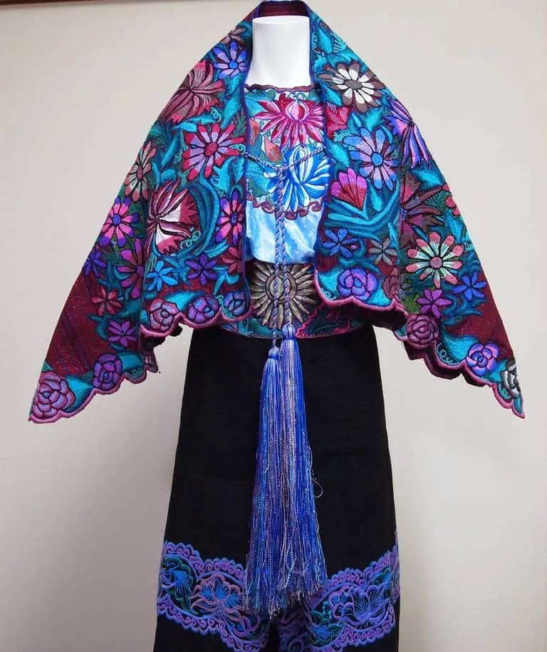 Traditional purple huipil outfits worn by Zinacantán women