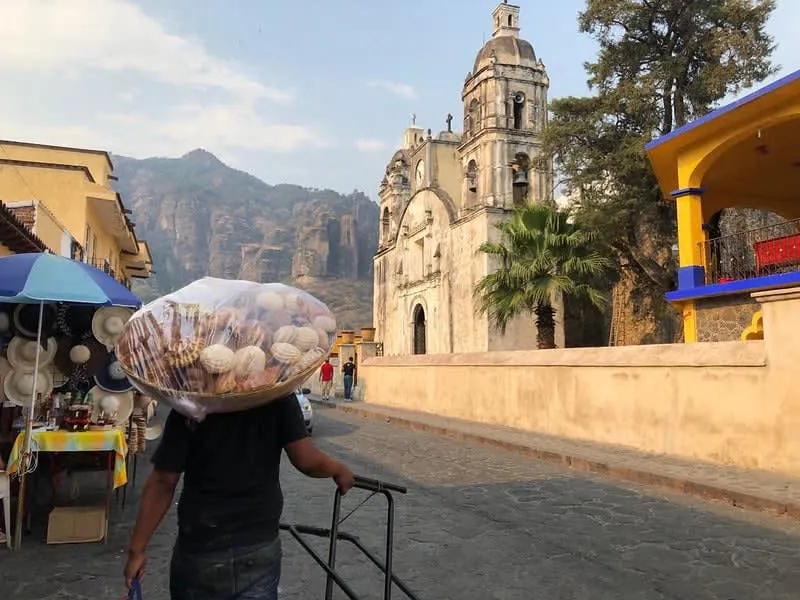 Colorful Chinelos dancers in elaborate embroidered costumes at Carnival celebration in Tepoztlán Morelos Mexico