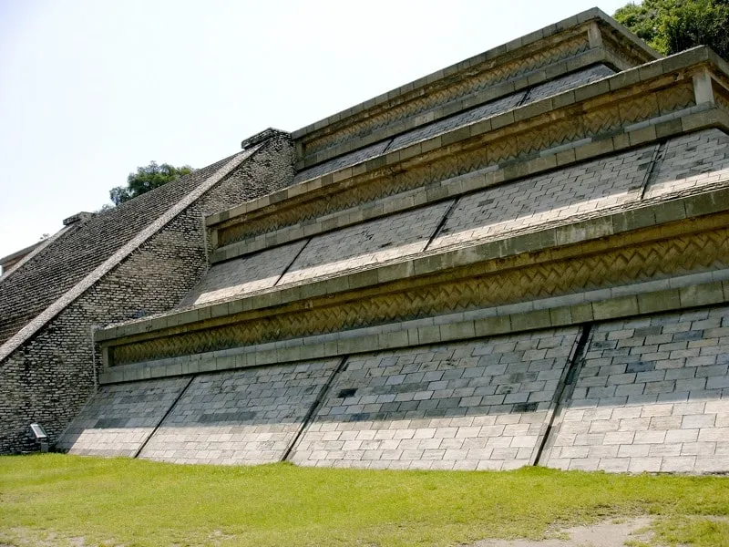 Cholula Great Pyramid with Nuestra Señora de los Remedios church on top against blue sky Puebla