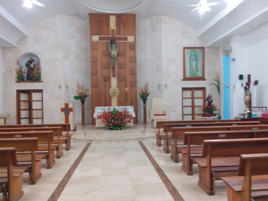 Church of San Antonio de Padua in Barra de Navidad — colonial yellow-painted church facade on the town plaza