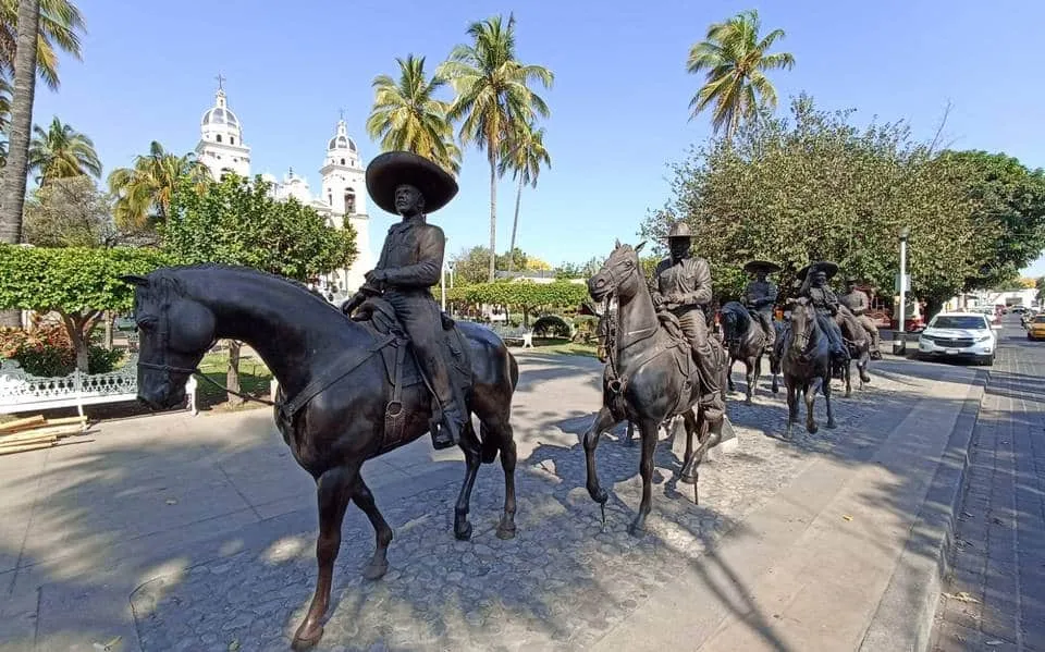 Tuba vendor in Colima Mexico carrying bamboo vessel with fermented coconut palm wine traditional street drink