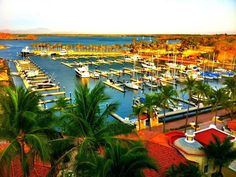 Isla Navidad Colima Mexico resort beach area with palm trees turquoise lagoon and marina facilities