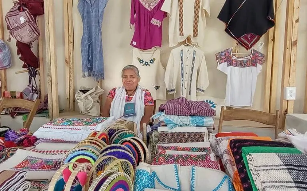 Indigenous artisans and traders at the Sunday tianguis market in Cuetzalan Puebla with traditional embroidery