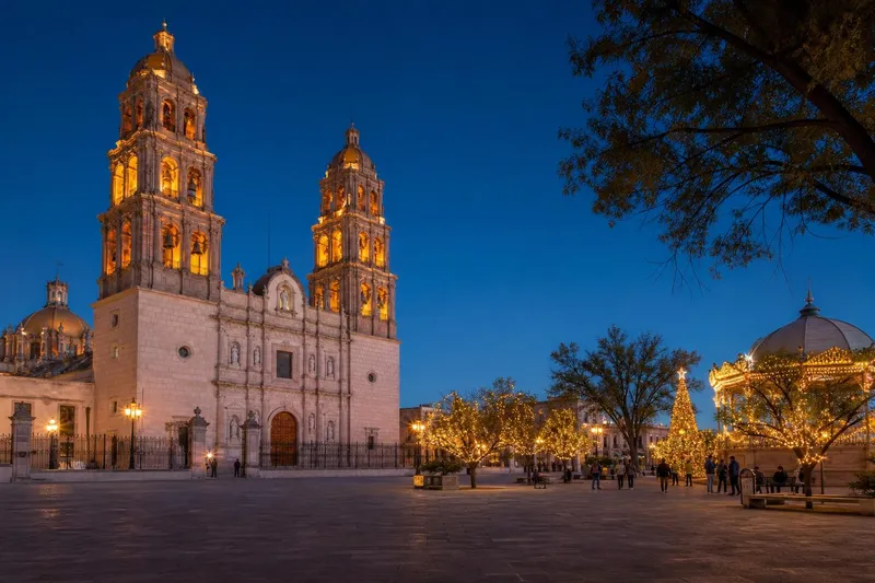 Durango cathedral plaza in December with Christmas lights and clear highland evening sky