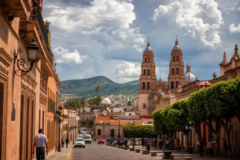 Durango cathedral and historic center under dramatic July rainy-season clouds