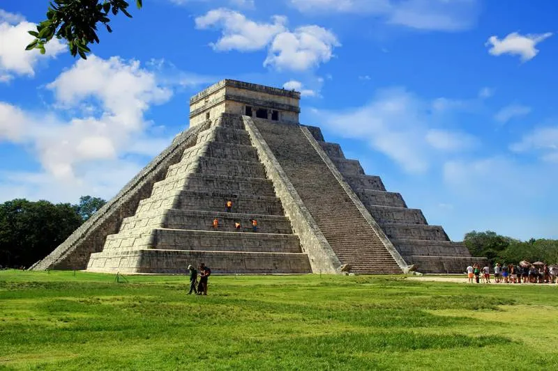 Ek Balam pyramid Acropolis at sunrise with lush jungle below — a still-climbable Maya ruin 25km from Valladolid with far fewer visitors than Chichen Itza