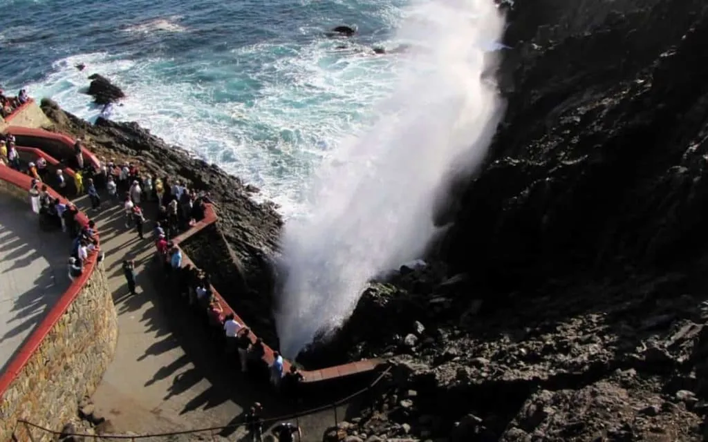 La Bufadora blowhole at Punta Banda, Ensenada — water plume erupting from the volcanic rock coastal formation in Baja California
