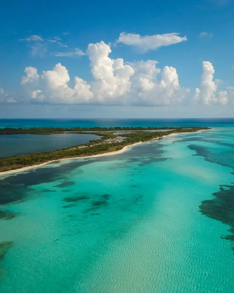Fishing boat crossing the Cozumel Channel between reefs and open Caribbean water