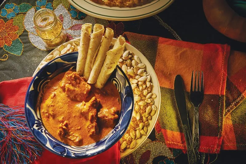 Pepita con tasajo — strips of dried smoked beef in a pumpkin seed and achiote sauce from Chiapas