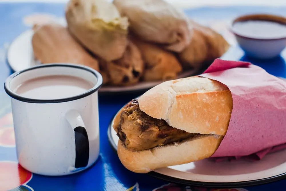 Guajolota tamal sandwich in a bolillo roll for a Mexico City breakfast
