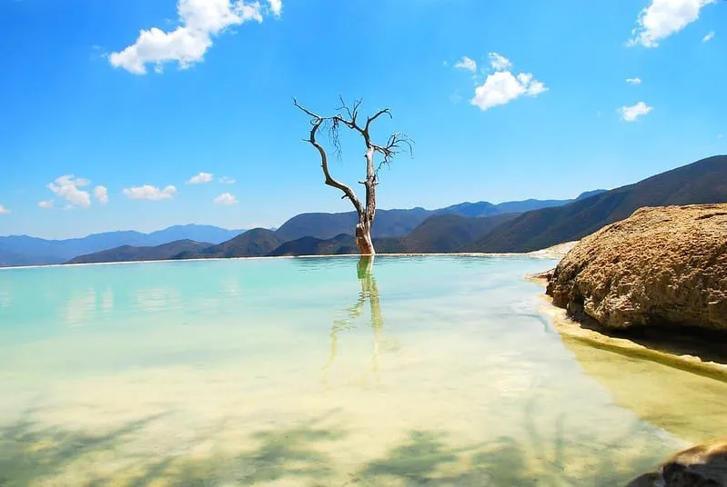 Natural mineral spring swimming pool at Hierve el Agua with petrified waterfall edge and canyon views