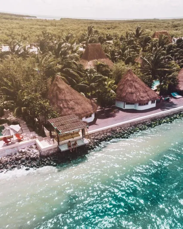 Las Nubes de Holbox hotel with beachside palapa design and tropical garden