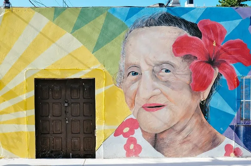 Colorful street mural on Holbox Island near the sandy beach roads