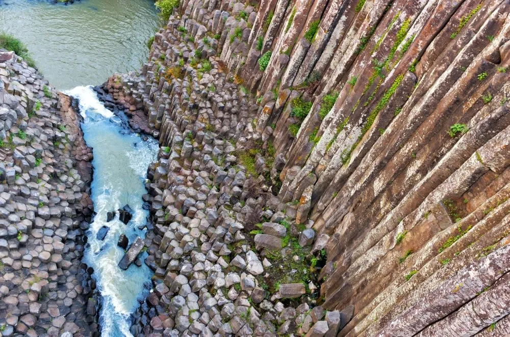 Basaltic prism cliffs and waterfall at Santa María Regla