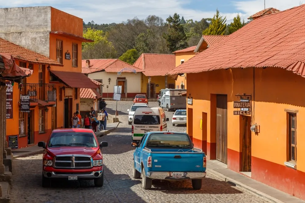 Colorful red-roofed houses on a Hidalgo village street